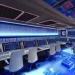 A futuristic control room with holographic interfaces, a central AI core glowing blue, surrounded by developers in sleek suits, screens displaying code and real‑time analytics, cinematic lighting highlighting the metallic surfaces, sharp details, …
